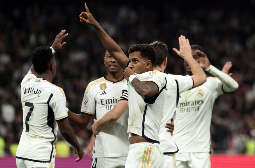 Rodrygo (C) celebrates scoring his team's fourth goal during the match between Real Madrid CF and Valencia CF at the Santiago Bernabeu stadium in Madrid on November 11, 2023. (Photo by THOMAS COEX/AFP via Getty Images)